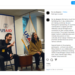 A screenshot of an instagram post by For La Diáspora showing Bruni Pizarro and David Pizarro smiling and doing a peace sign seated in front of a projector during the workshop. 