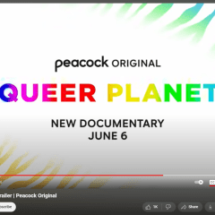 A screenshot of the YouTube trailer with rainbow colored text reading “QUEER PLANET” against a white and zebra print background. 