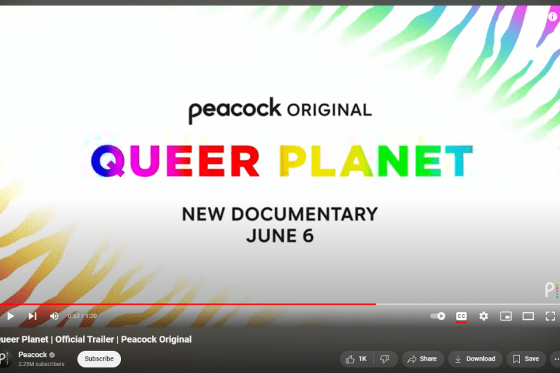 A screenshot of the YouTube trailer with rainbow colored text reading “QUEER PLANET” against a white and zebra print background. 